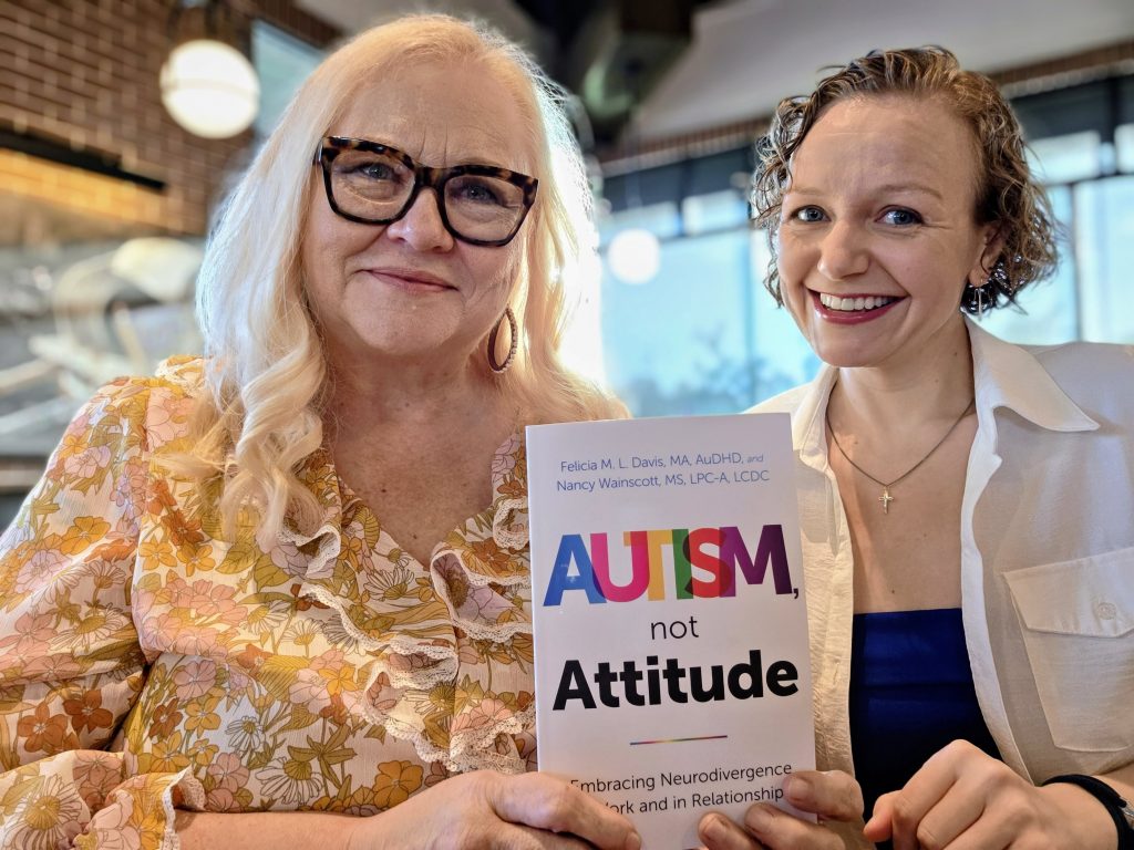 Nancy Wainscott & Felicia M. L. Davis with book Autism, Not Attitude